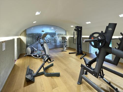 a gym with treadmills and exercise equipment in a building at RELAX APARTMENTS An der Lage Hochgraßnitzberg in Spielfeld