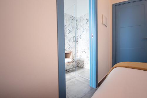 Ένα ή περισσότερα κρεβάτια σε δωμάτιο στο LaPortulaca Relax & Nature