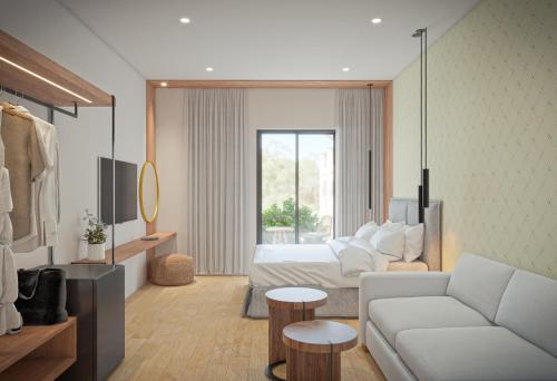 a living room with a couch and a bed at Nikon Boutique Hotel in Kalamaki