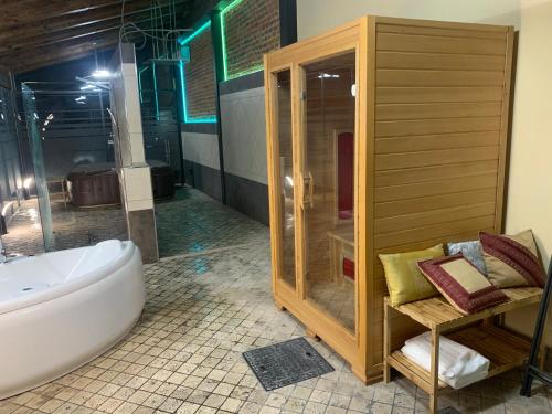 a large bathroom with a tub and a shower at Al Calar Della Sera in Sommariva del Bosco