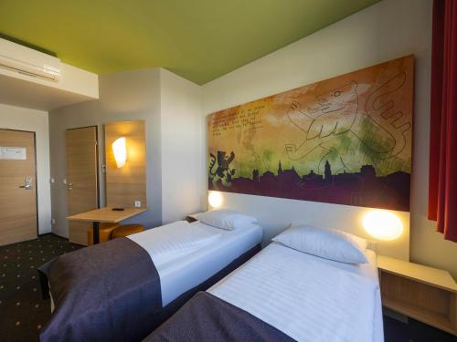 Postel nebo postele na pokoji v ubytování B&B Hotel Weimar