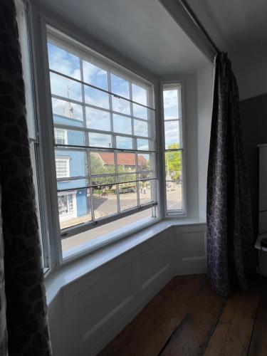 a window in a room with a curtain at White Horse in Maldon
