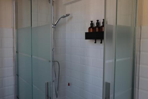 a shower in a bathroom with a glass shower stall at B&B La Casetta in Cambiago