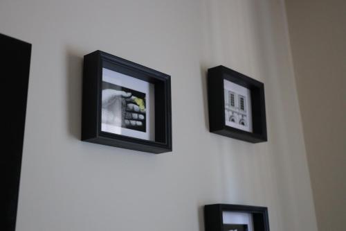 three pictures hanging on a wall at B&B La Casetta in Cambiago