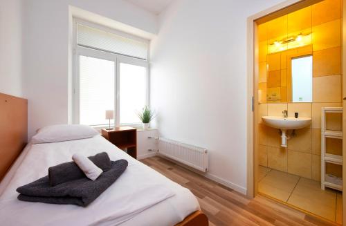 Кровать или кровати в номере PB Apartments