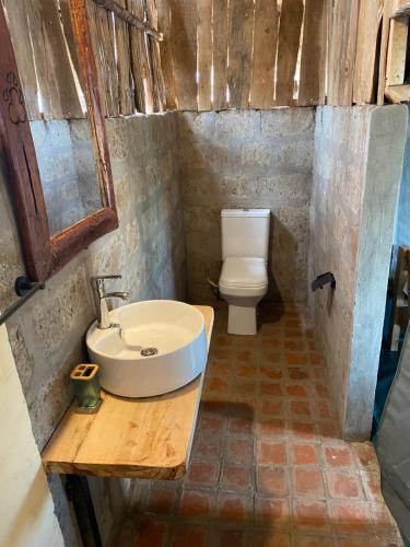 a bathroom with a sink and a toilet at Amboseli Discovery Camp in Amboseli
