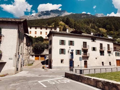 a white building on the side of a street at Guvi’sHome Bormio in Bormio