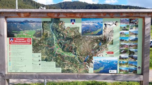a sign with a map on top of it at Appartement Twin Peak Edelweiss in Gosau