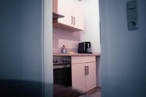 a kitchen with a sink and a stove top oven at schönes Apartment in der Altstadt , kostenlose Parkplätze in der Nähe in Emden