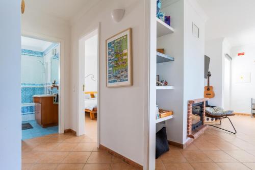 a hallway with a living room and a bedroom at Sweet Home Arrifana // Beachhouse in Praia da Arrifana