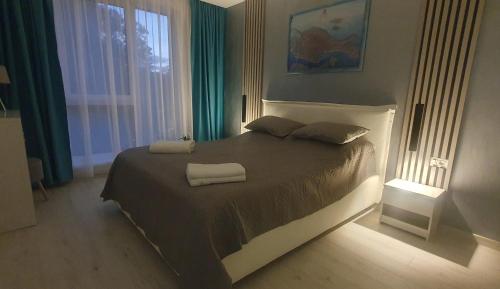 Llit o llits en una habitació de Coral Lux Residence