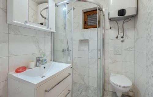 a bathroom with a toilet and a sink and a shower at Beautiful Apartment In Herceg Novi With 1 Bedrooms, Wifi And Outdoor Swimming Pool in Herceg-Novi