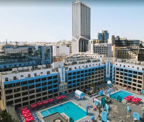 an aerial view of a city with a pool at The St. George’s Park Hotel in St. Julianʼs