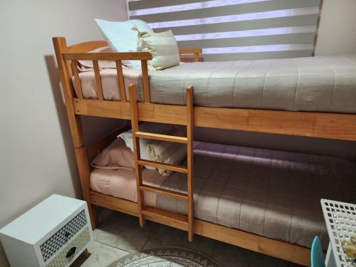 سرير أو أسرّة في غرفة في Playa y Descanso Chic