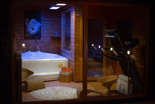 a bathroom with a bath tub in a room at VILLA KYRA LUXURY in Sinaia