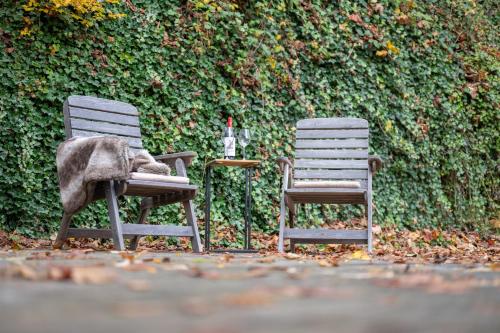 two chairs with a blanket sitting next to each other at Alpin & See Resort - Pinzgau Holidays in Zell am See