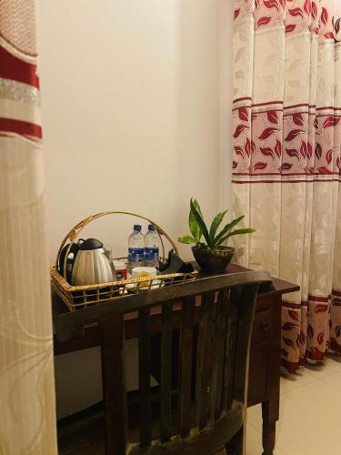 a table with a basket on top of it at Winston Sea Front Villa in Negombo