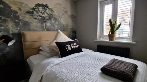 a bedroom with a bed with a pillow on it at Kings Sconce in Newark-on-Trent