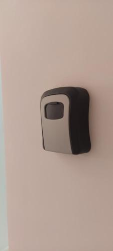 a black and white toaster on a white wall at SIA Studio in Oradea