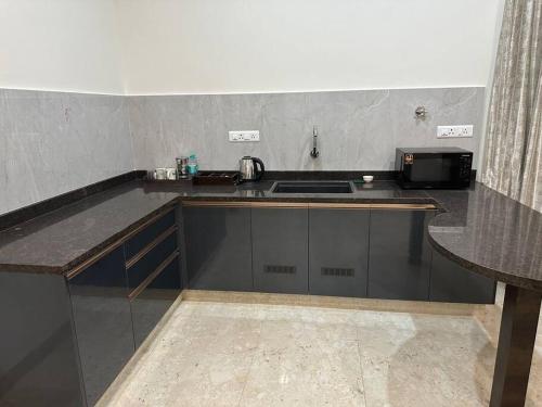 Dapur atau dapur kecil di Passaddhi Serviced Apartment S1