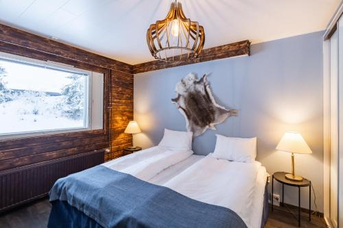 Postel nebo postele na pokoji v ubytování Hotel Metsähirvas