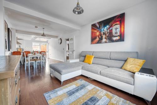 a living room with a couch and a table at 2 Bedroom Bungalow with Garden and Parking in Radcliffe on Trent