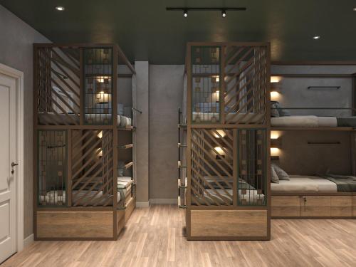 a room with three bunk beds in it at The Roof Tiles Hostel in Ho Chi Minh City