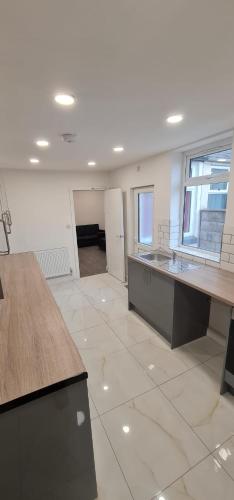 an empty room with a kitchen with a counter top at ASM One Bedroom Apartment (Flat 11) in Leicester