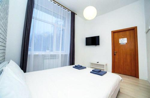 Uma cama ou camas num quarto em Atlas Hotel