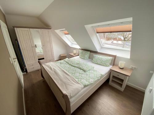 a small bedroom with a bed and a window at Dagmar 120qm 3 Schlafzimmer Wellness in Olsberg