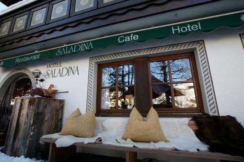 a store front with a window in the snow at Bio-Hotel Saladina in Gaschurn