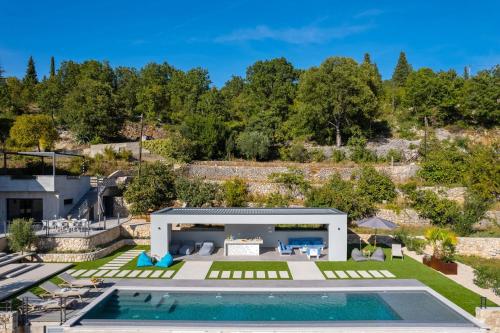 an aerial view of a villa with a swimming pool at Luxury Villa Depollo in Donji Vinjani