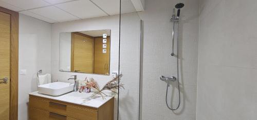 a bathroom with a shower and a sink at AlmeriaSuite City Centre in Almería