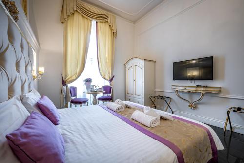 Ένα ή περισσότερα κρεβάτια σε δωμάτιο στο B&B La Terrazza Sul Duomo