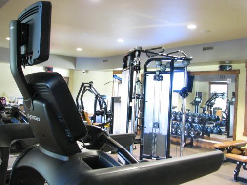 a gym with several tread machines and a treadmill at Lodge at Whitefish Lake in Whitefish