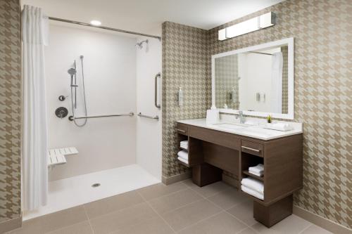a bathroom with a sink and a shower at Home2 Suites By Hilton Lake Mary Orlando in Lake Mary