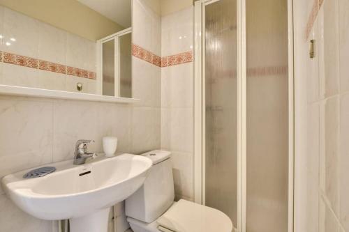 a bathroom with a toilet and a sink and a shower at Apartment W 2 bathrooms at 400m from the beach in Nice