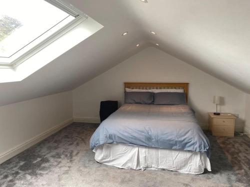 a bedroom with a bed in a attic at Cois Locha in Glenbeigh