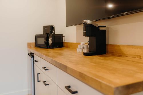 a kitchen with a counter top with a coffee maker at Bingham Motor Inn in Bingham