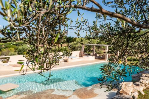 an image of a swimming pool in a villa at Sopra i Sassi - Villa & Trulli in Ostuni