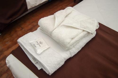 a pile of towels sitting on top of a table at Casona Valdelirios Hotel in Ayacucho