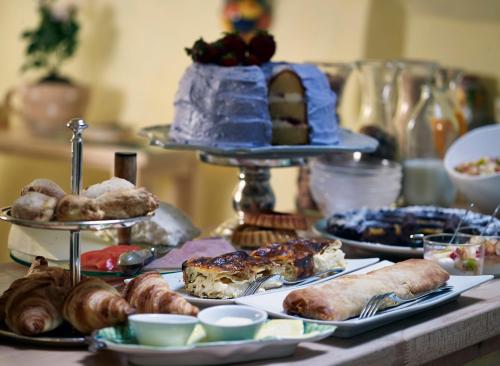 a table with several plates of food on a table at Villa Vager in Levidhion