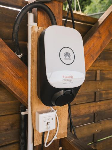 a soap dispenser is attached to a wood wall at Wellnessoase Nordschwarzwald in Neuweiler