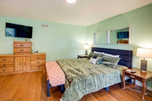 a bedroom with a bed and a dresser and a night stand at Soothing Studio with Lush Views 2 Mi to Beach! in Smith River
