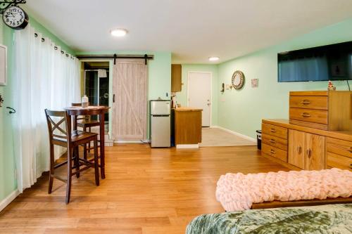 a living room with a table and a kitchen at Soothing Studio with Lush Views 2 Mi to Beach! in Smith River