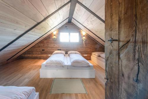 a bedroom with two beds in a attic at Chalet Buron 7 in Kaufbeuren