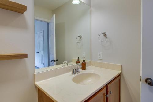 a bathroom with a sink and a mirror at Lynchburg Rental with Charcoal Grill Near Downtown! in Lynchburg