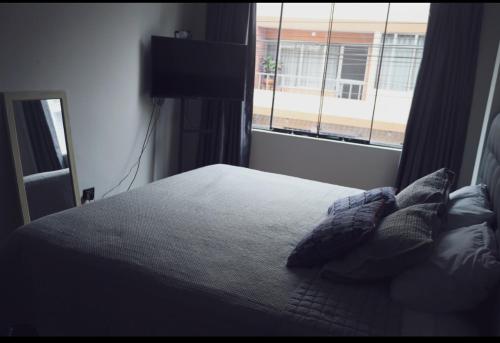 En eller flere senge i et værelse på Casa Sabina