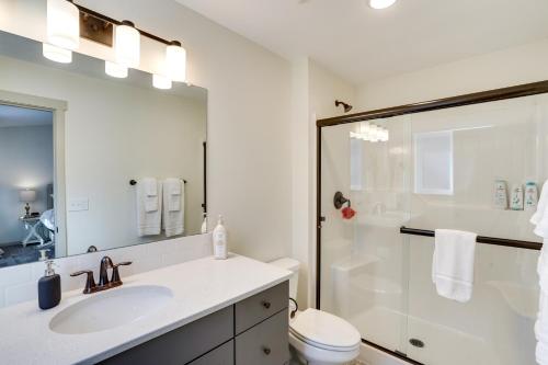 a white bathroom with a sink and a shower at Terrebonne Home Steps to Deschutes River! in Terrebonne