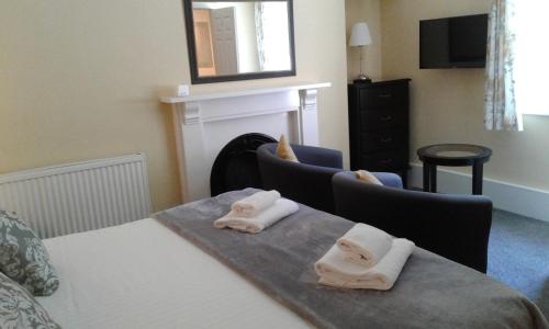 Katil atau katil-katil dalam bilik di Elton Guest House
